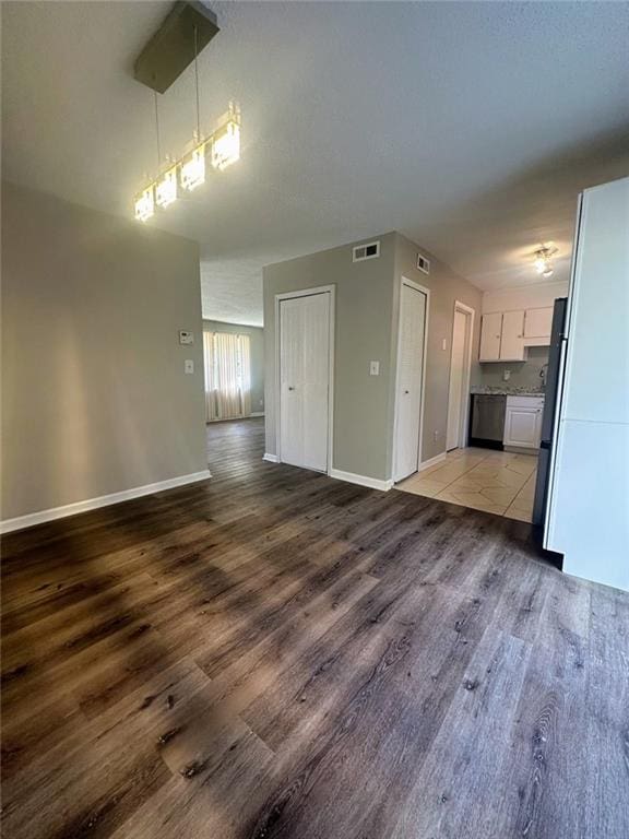 4701 Flat Shoals Rd, Union City, GA 30291 - unfurnished living room with wood finished floors and baseboards