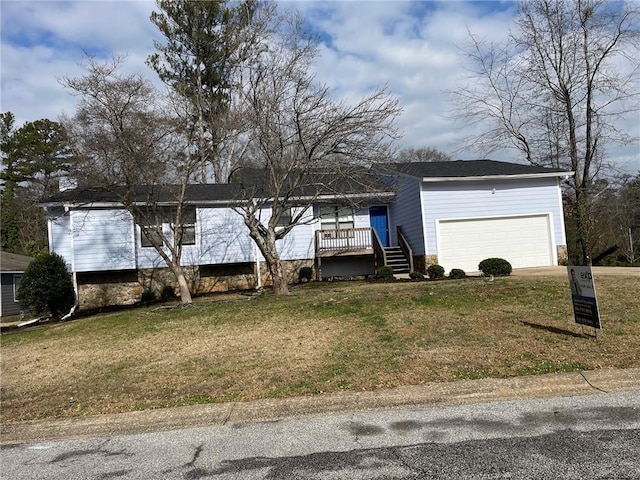 view of front of property featuring a garage and a front lawn