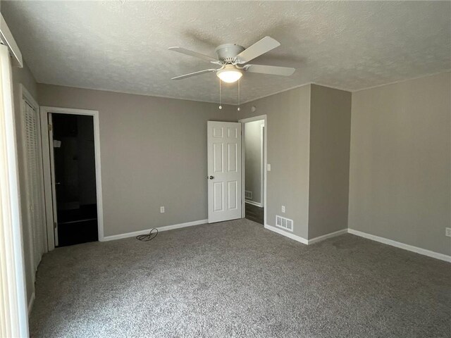 kitchen with wood tiled floor, white cabinetry, vaulted ceiling, light stone countertops, and stainless steel fridge