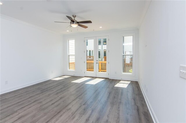 empty room featuring french doors, ceiling fan, ornamental molding, and dark hardwood / wood-style flooring