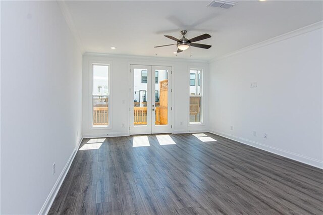 spare room with ornamental molding, dark wood-type flooring, french doors, and ceiling fan