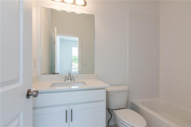 full bathroom featuring vanity, toilet, and  shower combination