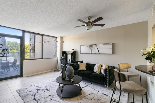 1280 W Peachtree St NW Unit 810, Atlanta, GA 30309 - living area with baseboards, a textured ceiling, ceiling fan, and light tile patterned floors