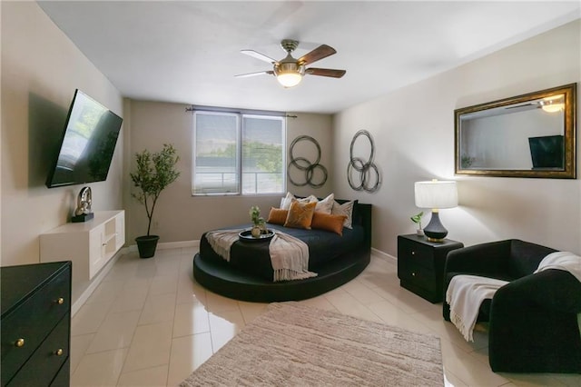 1280 W Peachtree St NW Unit 810, Atlanta, GA 30309 - bedroom with baseboards, a ceiling fan, and light tile patterned flooring