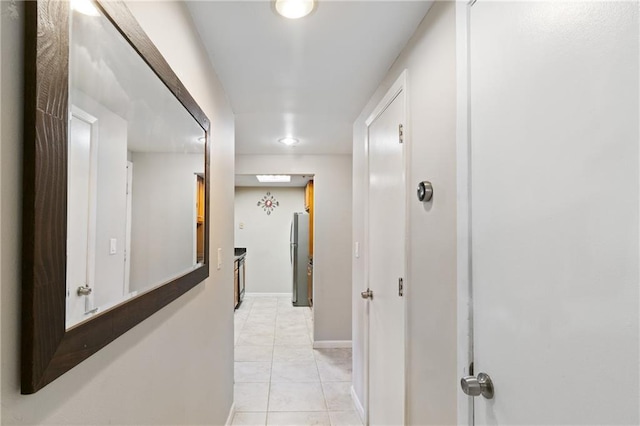 1280 W Peachtree St NW Unit 810, Atlanta, GA 30309 - hallway featuring baseboards and light tile patterned flooring