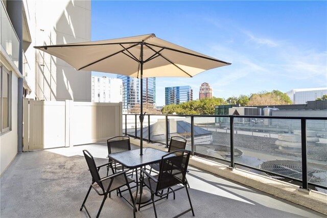 1280 W Peachtree St NW Unit 810, Atlanta, GA 30309 - view of patio with a city view and a balcony