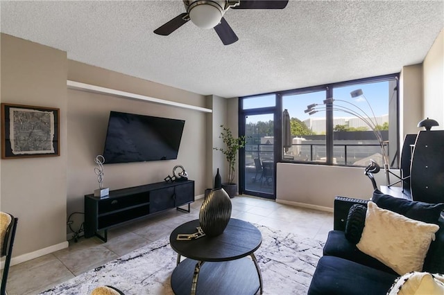 1280 W Peachtree St NW Unit 810, Atlanta, GA 30309 - living room with baseboards, tile patterned flooring, a ceiling fan, and a textured ceiling