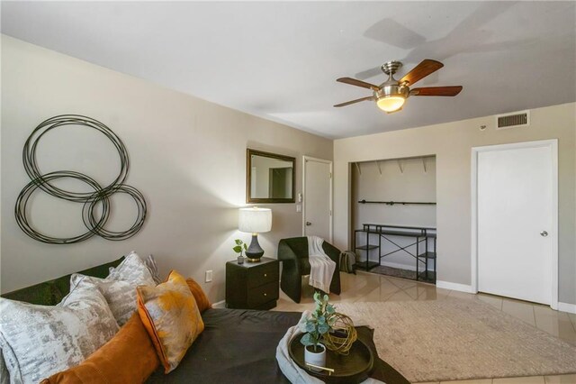 1280 W Peachtree St NW Unit 810, Atlanta, GA 30309 - tiled living room featuring visible vents, baseboards, and ceiling fan