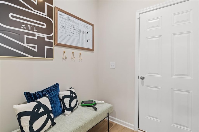 interior space with light wood finished floors and baseboards