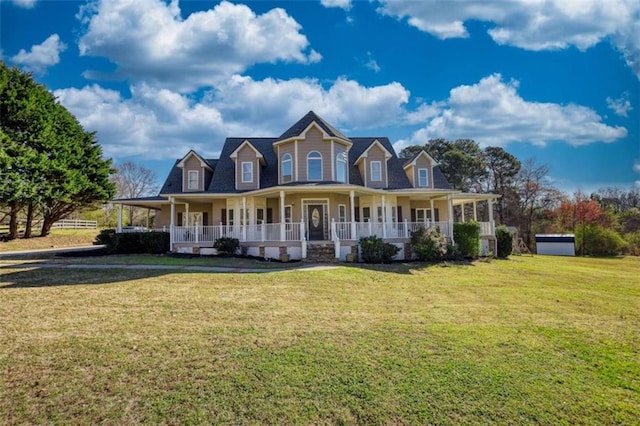 farmhouse-style home featuring an attached carport, a front yard, and a porch