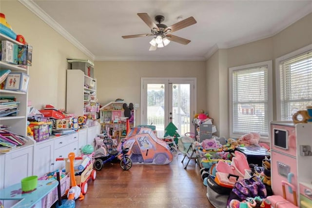 recreation room featuring a ceiling fan, wood finished floors, french doors, and crown molding
