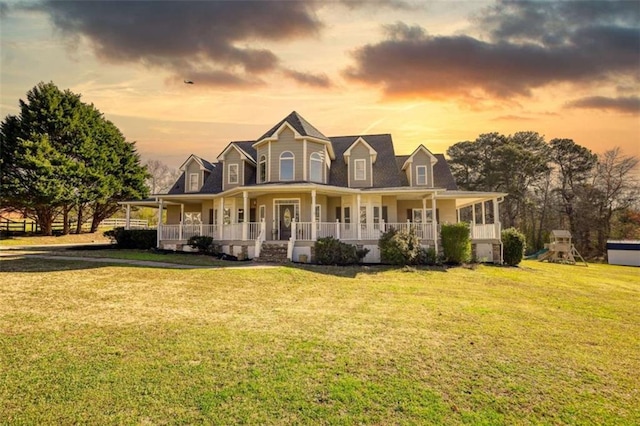 view of front of home featuring a front yard and a porch