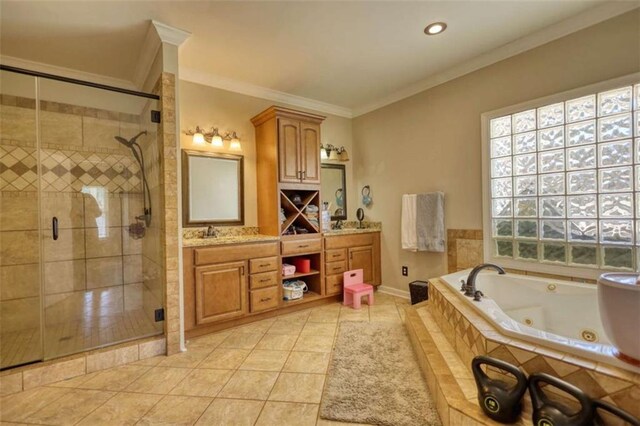 full bath with crown molding, a shower stall, double vanity, a tub with jets, and a sink