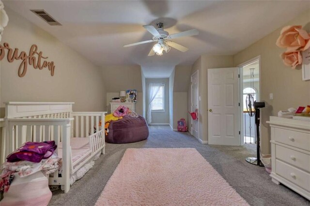 bedroom featuring baseboards, visible vents, carpet flooring, and a ceiling fan