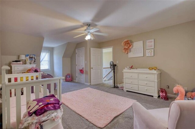 carpeted bedroom with baseboards and ceiling fan