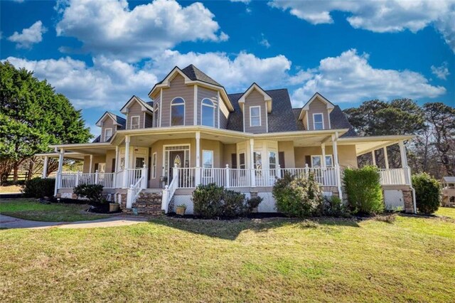 view of front of property with a porch and a front lawn