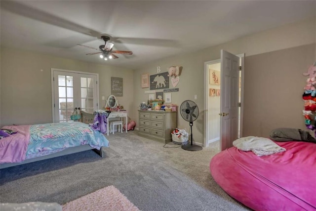 bedroom with ceiling fan, french doors, and carpet
