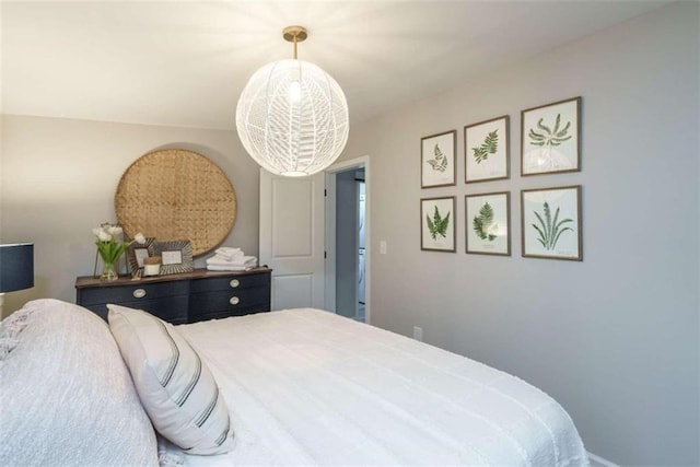 bedroom featuring a chandelier