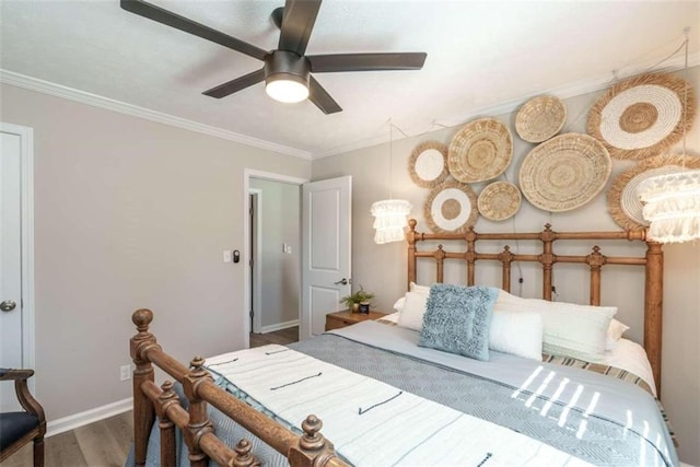 bedroom featuring ceiling fan, ornamental molding, and hardwood / wood-style flooring