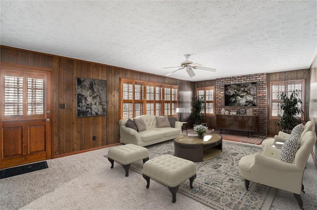 1791 Lake George Dr, Lithia Springs, GA 30122 - carpeted living area with wooden walls, ceiling fan, and a textured ceiling