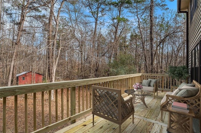 1791 Lake George Dr, Lithia Springs, GA 30122 - wooden deck featuring an outbuilding, a shed, and outdoor lounge area