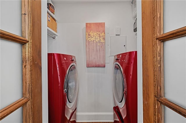 clothes washing area featuring laundry area and washing machine and dryer