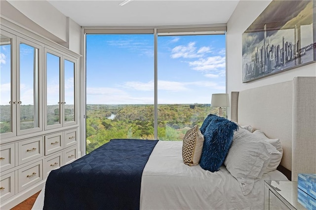 bedroom featuring a wall of windows