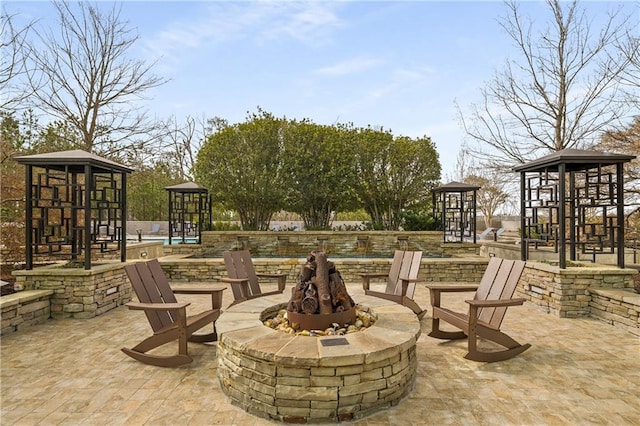 view of patio with an outdoor fire pit