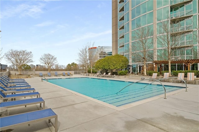 community pool with a patio area