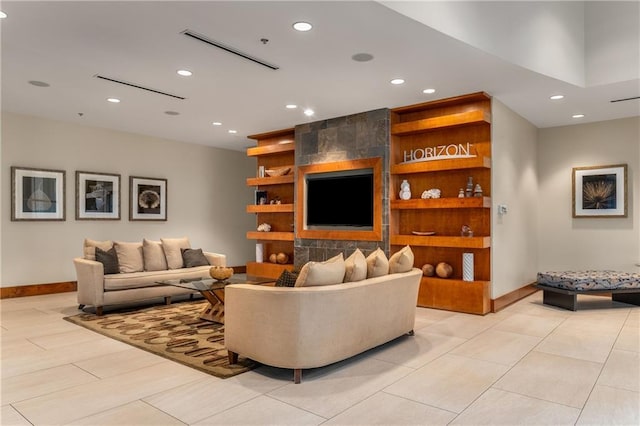living room featuring recessed lighting and baseboards