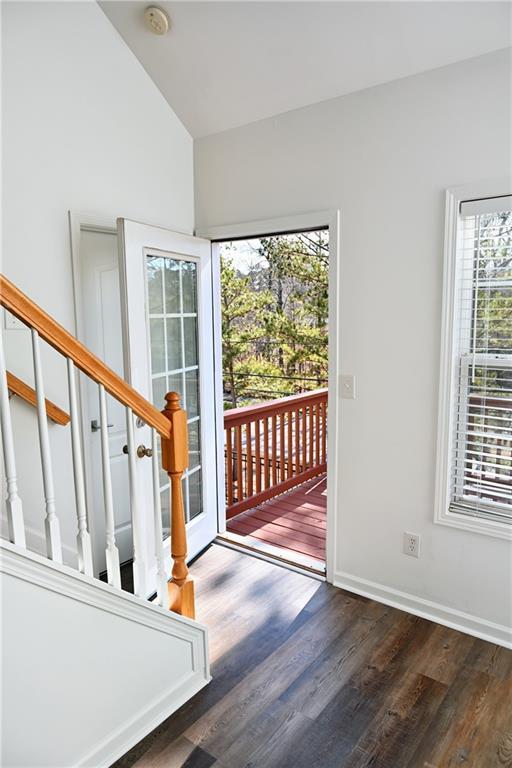 foyer featuring lofted ceiling and dark hardwood / wood-style flooring