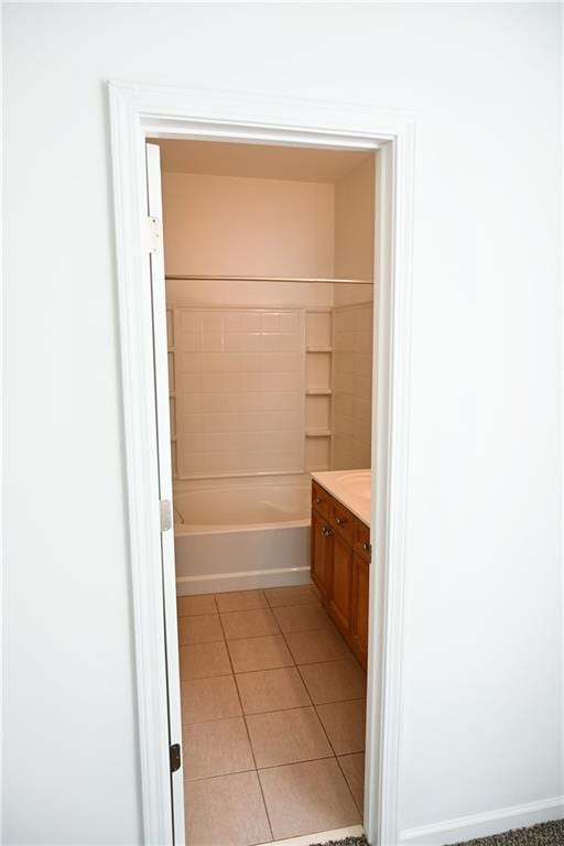 bathroom featuring tile patterned flooring, vanity, and shower / bathing tub combination