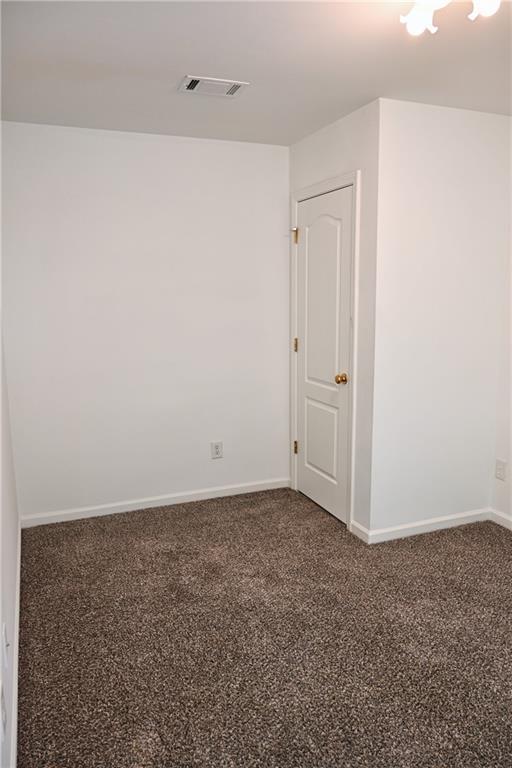 corridor with dark carpet