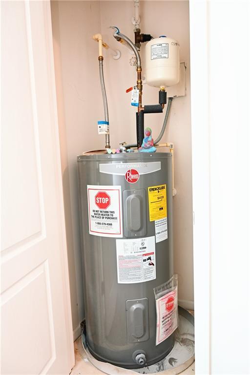 utility room with water heater