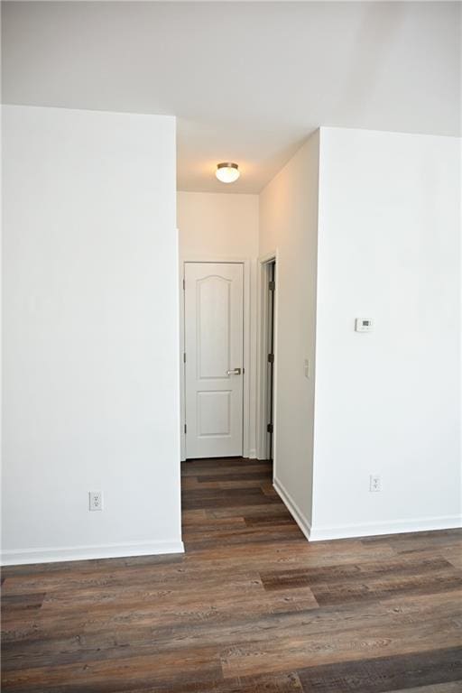 hallway featuring dark wood-type flooring