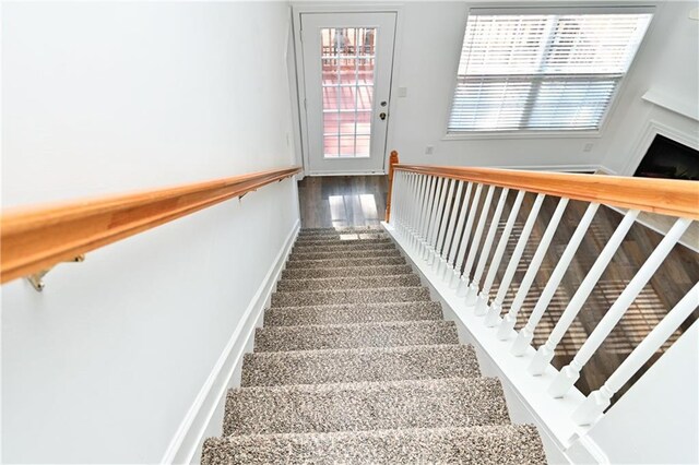 unfurnished room with carpet floors and vaulted ceiling