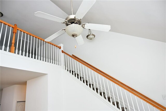 interior space with an inviting chandelier, a towering ceiling, and dark hardwood / wood-style floors