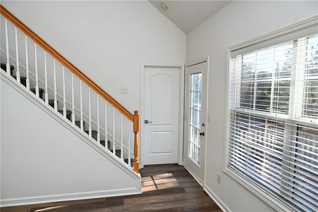 stairs featuring ceiling fan and lofted ceiling