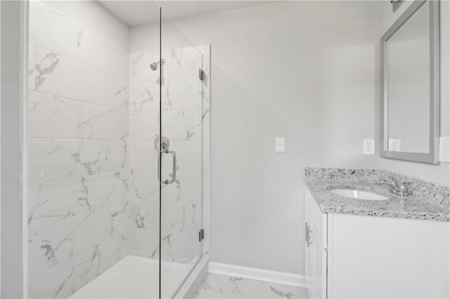 bathroom with vanity and an enclosed shower