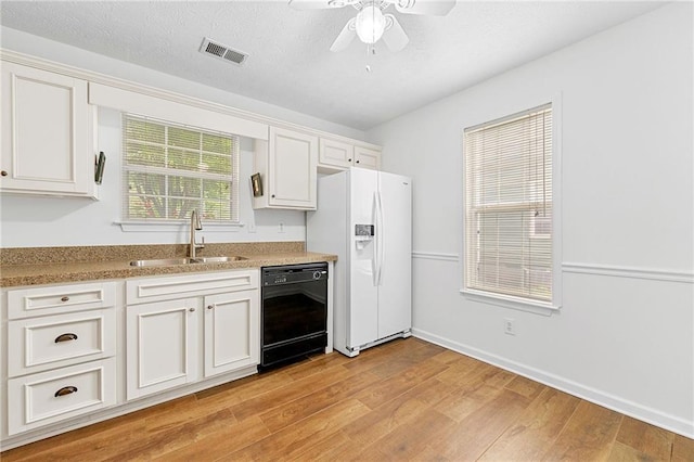 3040 Majestic Park Ct, Duluth, GA 30096 - kitchen featuring black dishwasher, a sink, white fridge with ice dispenser, ceiling fan, and light wood-style flooring