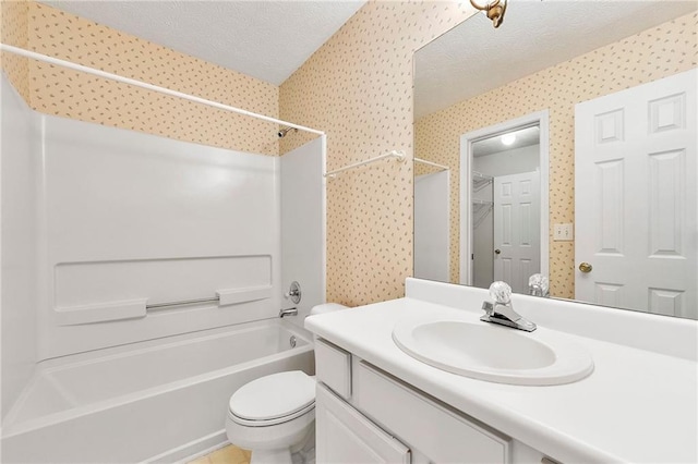 3040 Majestic Park Ct, Duluth, GA 30096 - bathroom featuring a textured ceiling, washtub / shower combination, toilet, vanity, and wallpapered walls