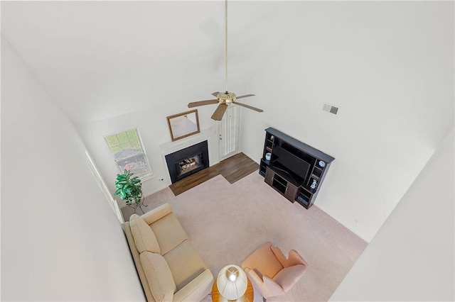 3040 Majestic Park Ct, Duluth, GA 30096 - carpeted living room with ceiling fan, a fireplace, and lofted ceiling