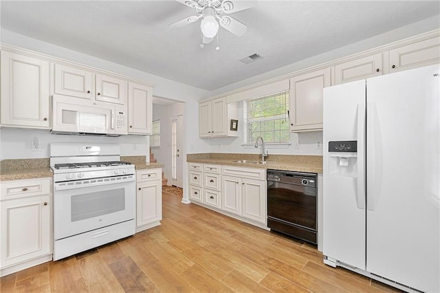 3040 Majestic Park Ct, Duluth, GA 30096 - kitchen with white appliances, a sink, light wood-style floors, and a ceiling fan