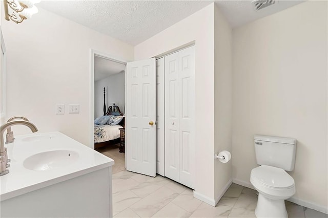 3040 Majestic Park Ct, Duluth, GA 30096 - full bathroom featuring marble finish floors, a closet, toilet, double vanity, and baseboards
