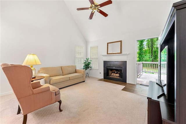 3040 Majestic Park Ct, Duluth, GA 30096 - carpeted living area with a fireplace with flush hearth, high vaulted ceiling, ceiling fan, and baseboards