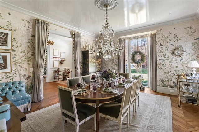 dining room featuring crown molding, parquet floors, and an inviting chandelier