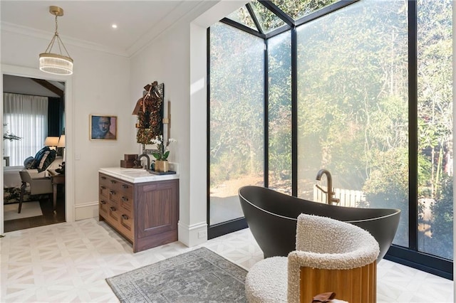 interior space featuring vanity, parquet flooring, crown molding, and a tub to relax in