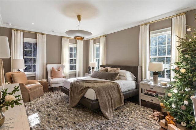 bedroom featuring crown molding