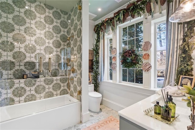 bathroom featuring crown molding, vanity, and toilet