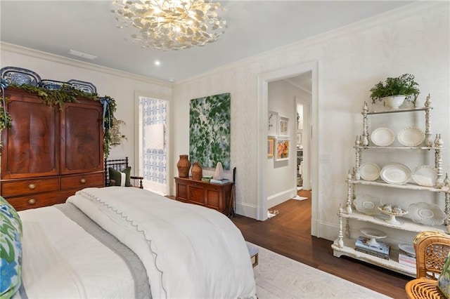 bedroom with an inviting chandelier, crown molding, and dark wood-type flooring